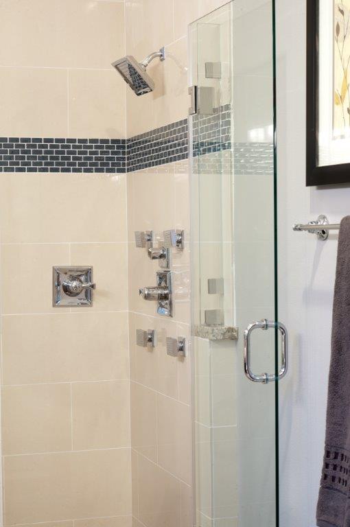  For the beautiful spa-like master bath: Large Frameless Glass Shower with 6 Shower Heads Spa-like Master Bath with separate sinks and free-standing soaking tub 